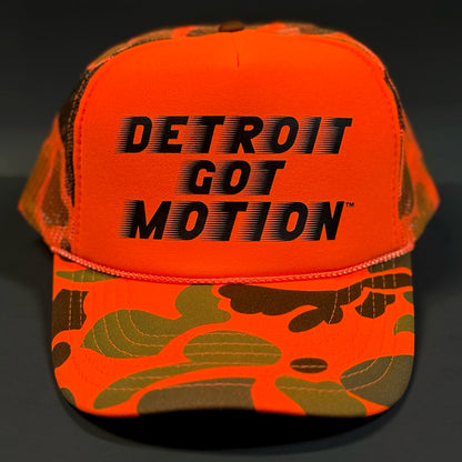 DETROIT GOT MOTION™ – TRUCKER HAT (Hi-Vis Orange Camo)